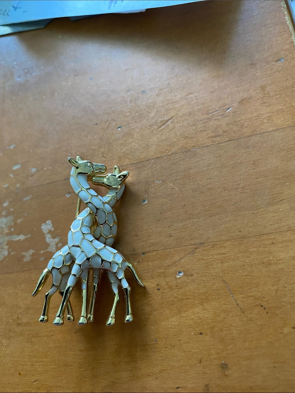 Vintage giraffe entwined brooch